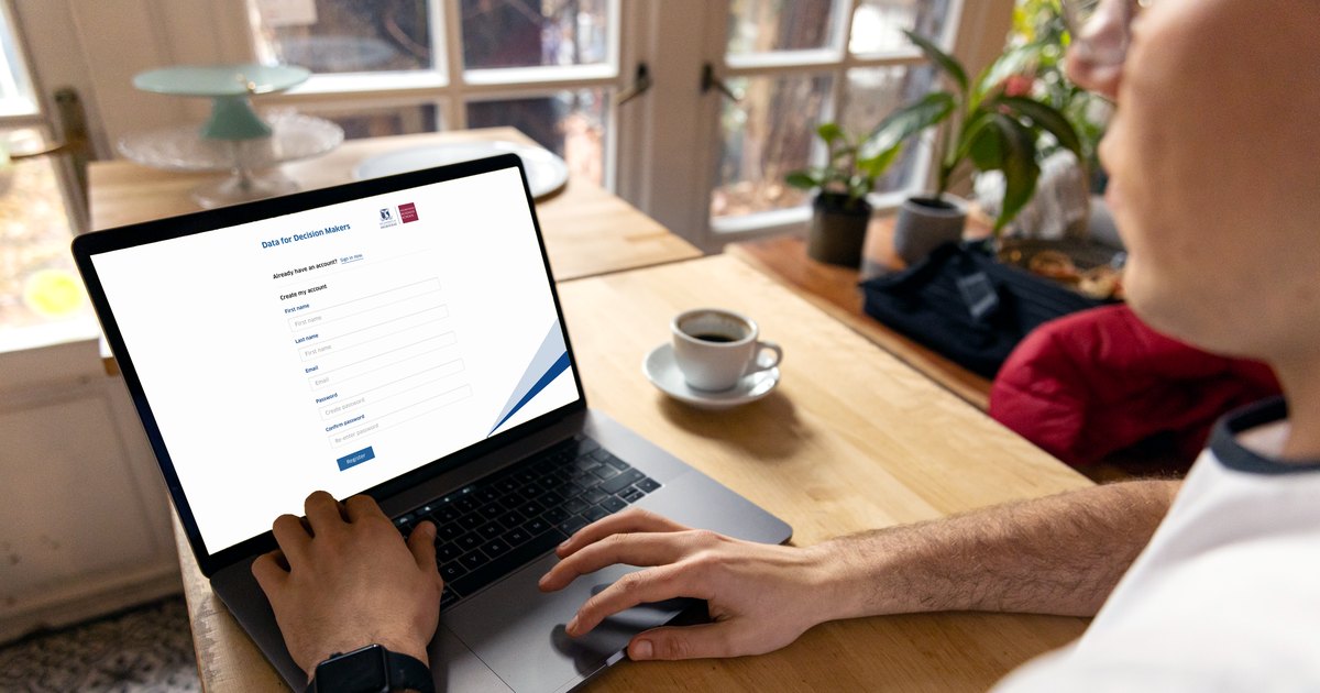 Someone registering for a Melbourne Business School course on a laptop